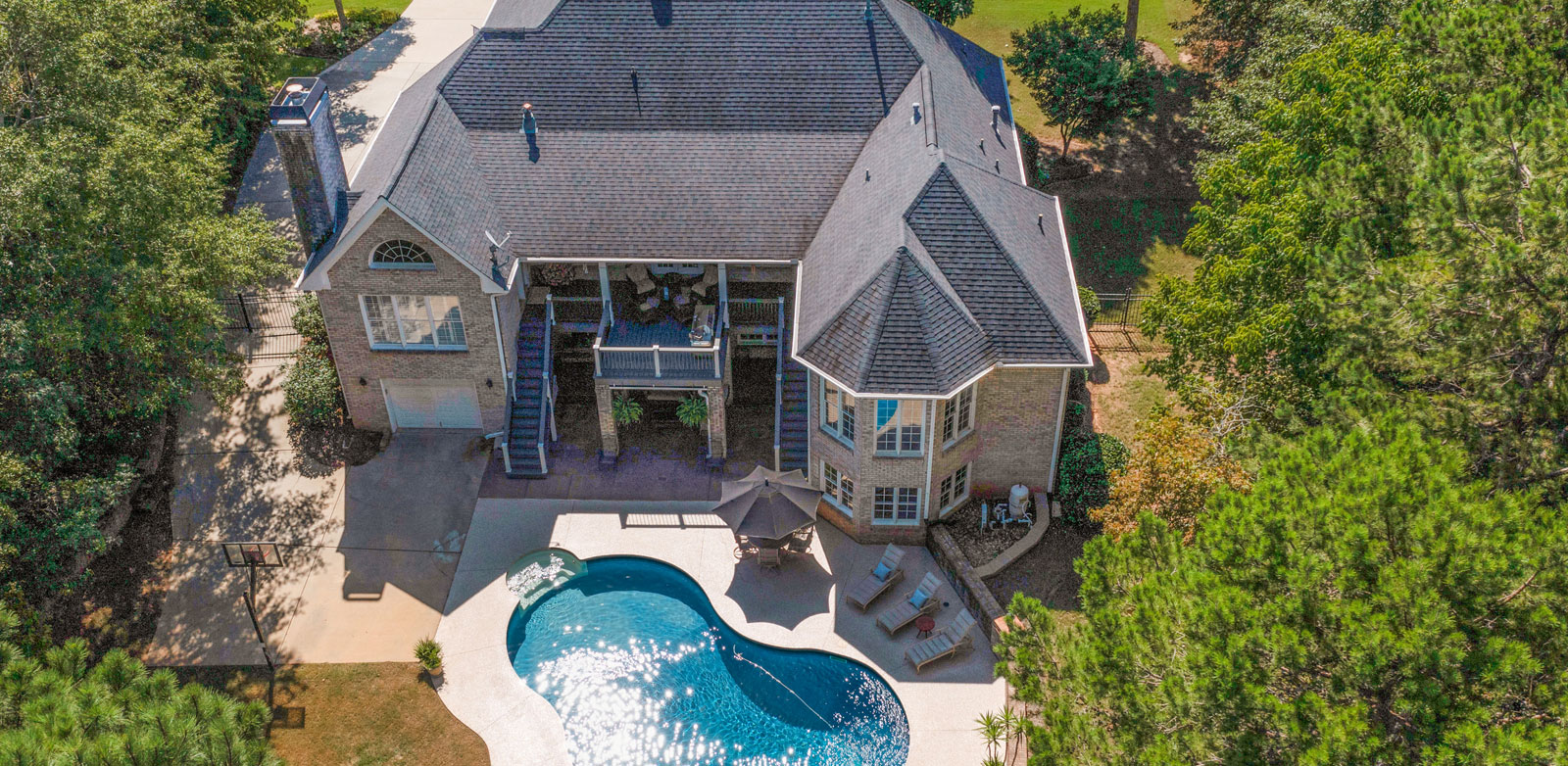 Home with outdoor pool aerial shot